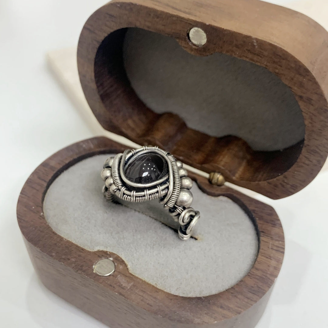 The handmade Indian Starlight Silica Wire Stone, wrapped and woven in 925 sterling silver craftsmanship.