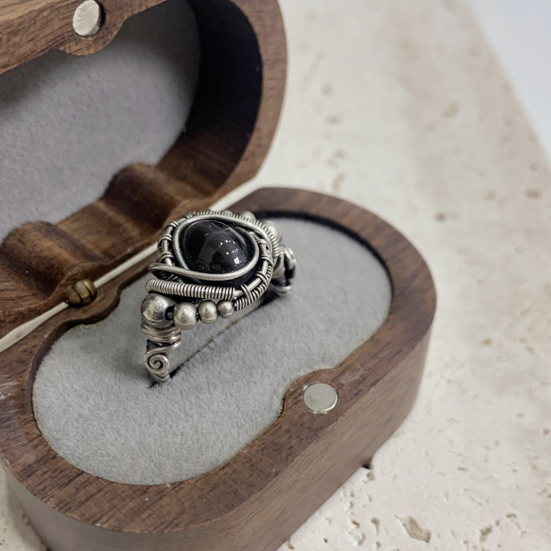 The handmade Indian Starlight Silica Wire Stone, wrapped and woven in 925 sterling silver craftsmanship.