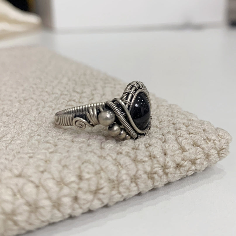 The handmade Indian Starlight Silica Wire Stone, wrapped and woven in 925 sterling silver craftsmanship.