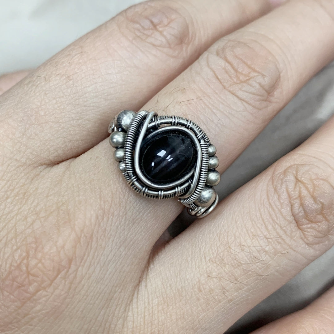The handmade Indian Starlight Silica Wire Stone, wrapped and woven in 925 sterling silver craftsmanship.