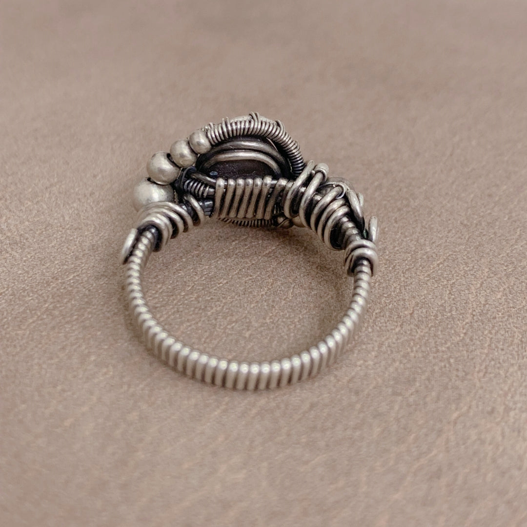 The handmade Indian Starlight Silica Wire Stone, wrapped and woven in 925 sterling silver craftsmanship.