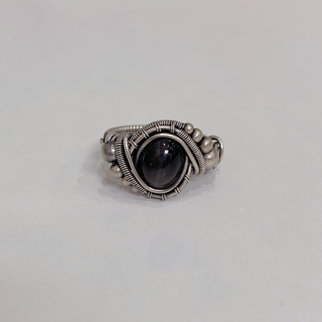 The handmade Indian Starlight Silica Wire Stone, wrapped and woven in 925 sterling silver craftsmanship.